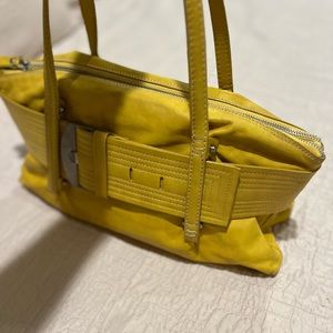 I bought this yellow purse in Positano Italy is 100% leather and is new